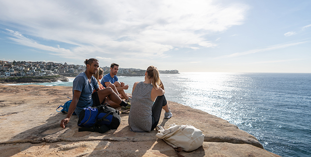 Students a beach in Sydney