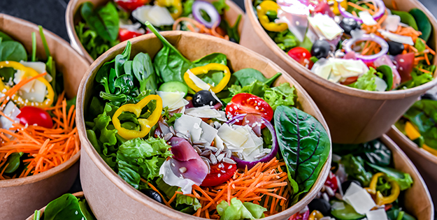 Prepared salads in cardboard containers
