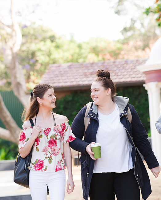 Two students walking through North Sydney Campus