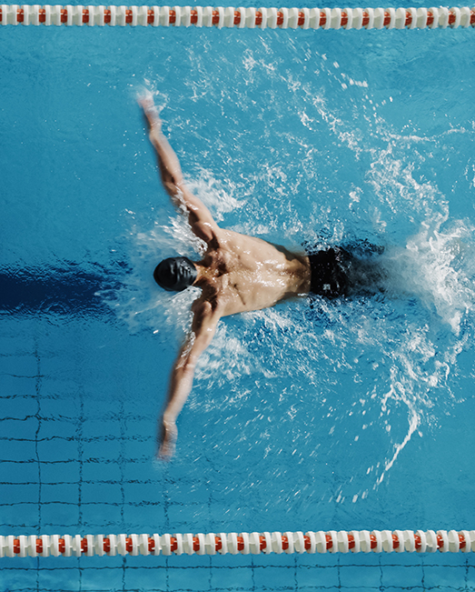 Overhead shot of swimmer in lanes