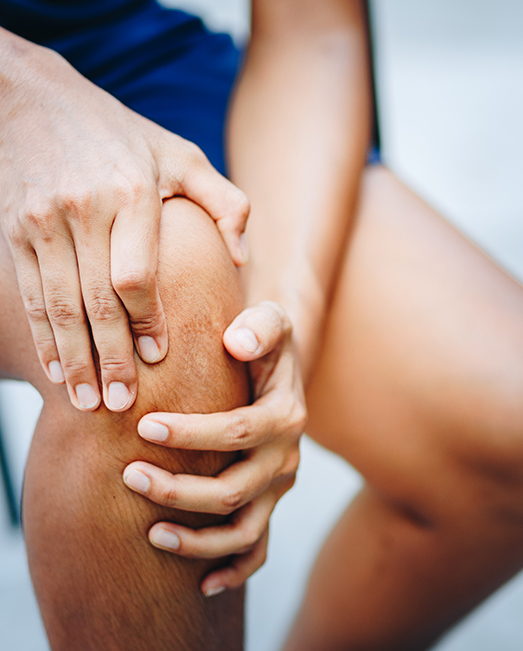 Patient grabbing sore knee