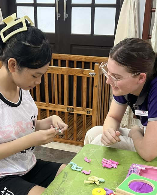 ACU occupational therapy student at work in Vietnam.
