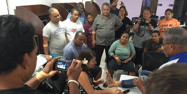 Maria demonstrating to locals