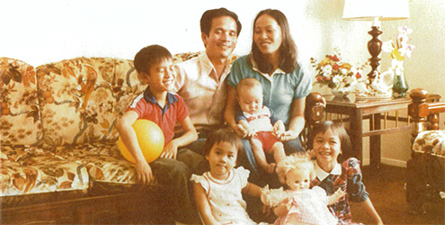 A young Anh (right) with her family.