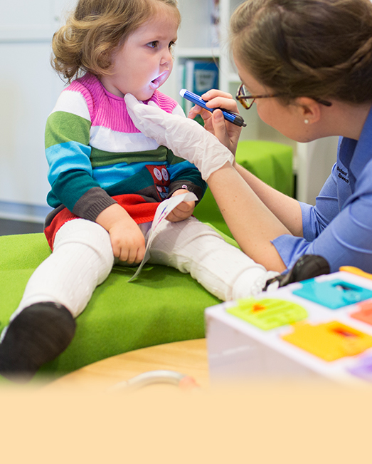 Speech pathologist working with a child