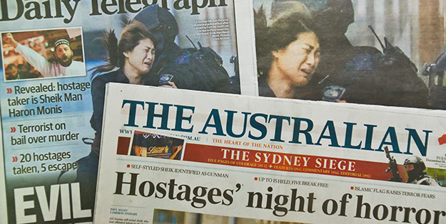Newspapers reporting on Lindt Cafe siege in Sydney in Dec 2014.