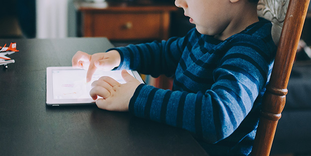 Boy using iPad